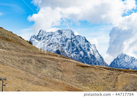 view of mountain slope and snow-covered peak view of mountain slope and snow-covered peak 44717784
