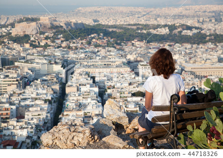 woman with a map sitting on Lycabettus Hill 44718326