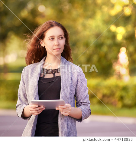 Girl with laptop. Outdoors. Young student. Office Girl with laptop. Outdoors. Young student. Office 44718853