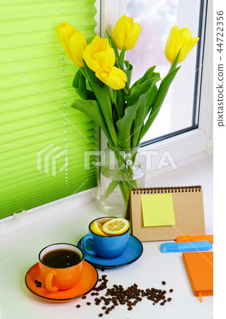 Yellow tulips, tea and coffee Yellow tulips, tea and coffee 44722356