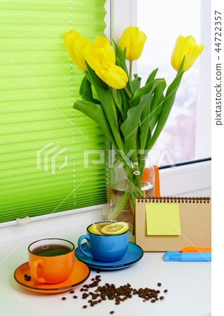 Yellow tulips, tea and coffee Yellow tulips, tea and coffee 44722357