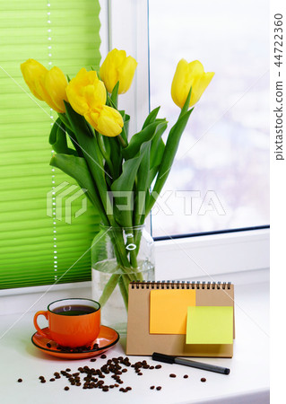 Yellow tulips and cup of coffee Yellow tulips and cup of coffee 44722360