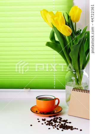 Yellow tulips and cup of coffee 44722361
