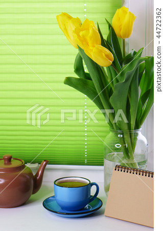 Yellow tulips and cup of tea Yellow tulips and cup of tea 44722362