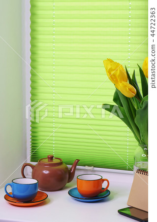 Yellow tulips, cups and teapot Yellow tulips, cups and teapot 44722363
