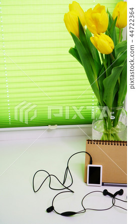 Yellow tulips, player and notepad Yellow tulips, player and notepad 44722364