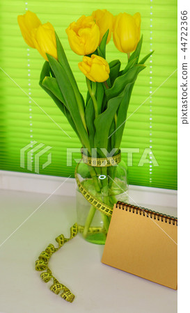 Yellow tulips in jar 44722366