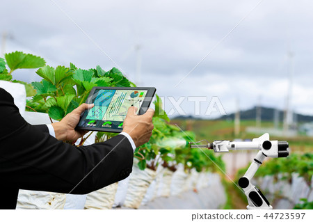 Farmer business holding a tablet smart arm robot 44723597