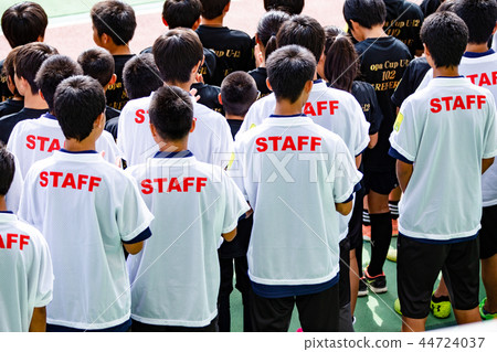 Behind the staff 44724037