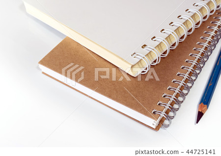 The spiral notebook with pencil The spiral notebook with pencil 44725141