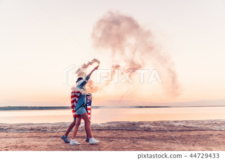 american couple with hand flare or fusee american couple with hand flare or fusee 44729433