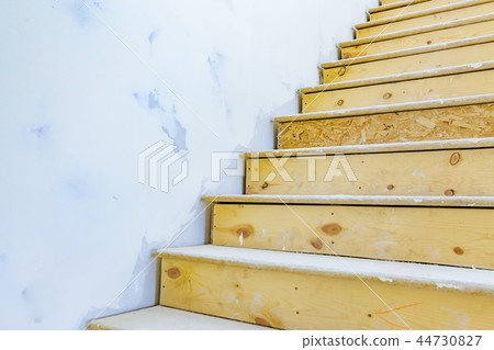 Stairs inside of house under construction 44730827