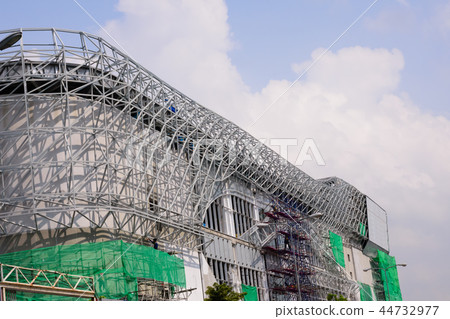 Construction workers binding steel frame. 44732977