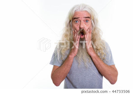 Studio shot of senior bearded man looking shocked with both hand Studio shot of senior bearded man looking shocked with both hand 44733506