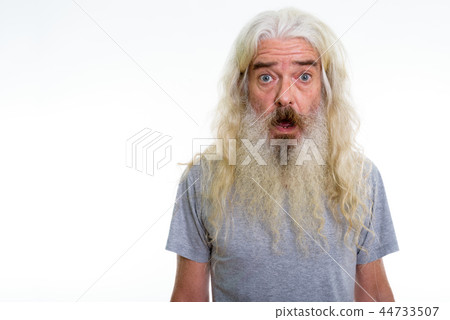 Studio shot of senior bearded man looking shocked 44733507