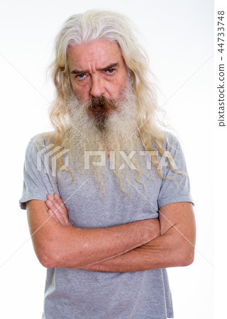 Studio shot of angry senior bearded man with arms crossed Studio shot of angry senior bearded man with arms crossed 44733748