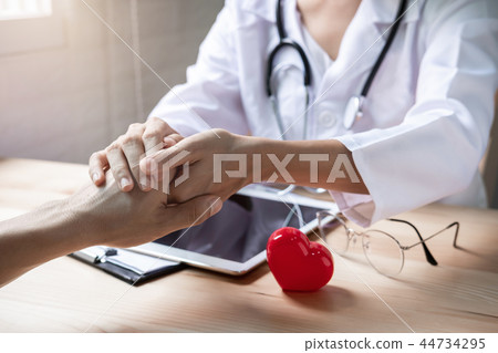 doctor hands reassuring her patient 44734295