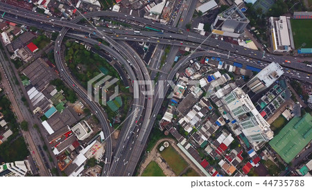 Cars driving on bridge roads shaped curve highways with skyscrap Cars driving on bridge roads shaped curve highways with skyscrap 44735788