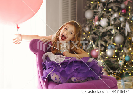 Little girl celebrates Christmas at home 44736485
