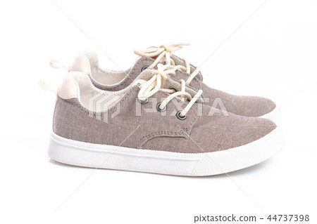 Close up of kids sneakers on white background Close up of kids sneakers on white background 44737398