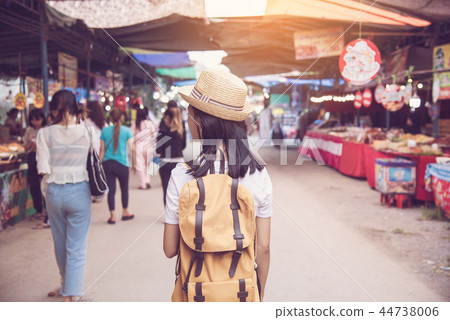 Teenagers backpacking along the market  44738006