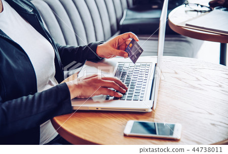Hand holding a credit card in their hands and find Hand holding a credit card in their hands and find 44738011