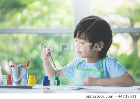boy painting a picture boy painting a picture 44738431