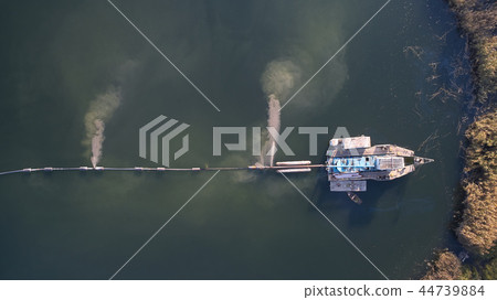 On the river there are works on extraction of sand. Works dredge 44739884