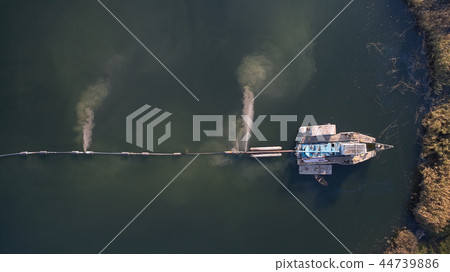 On the river there are works on extraction of sand. Works dredge 44739886