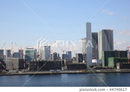 Construction site and high-rise apartment buildings of the 2020 Tokyo Olympic Village seen from the Toyosu market rooftop Construction site and high-rise apartment buildings of the 2020 Tokyo Olympic Village seen from the Toyosu market rooftop 44740617
