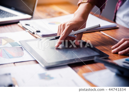 Business women working with tablets and laptops Business women working with tablets and laptops 44741834