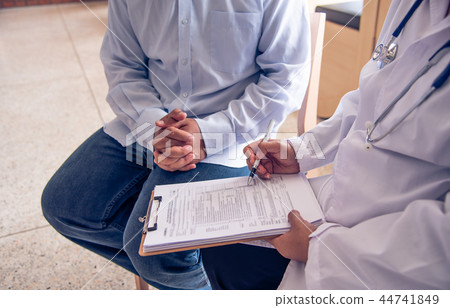 The doctor is discussing with the patient The doctor is discussing with the patient 44741849