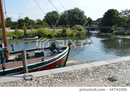 Yachts anchored in a canal found in Ribe, Denmark Yachts anchored in a canal found in Ribe, Denmark 44742006
