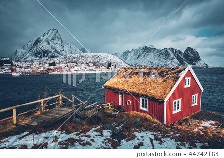 Traditional red rorbu house in Reine village on Lofoten Islands, Traditional red rorbu house in Reine village on Lofoten Islands, 44742183