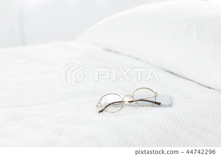 Bed and glasses 44742296