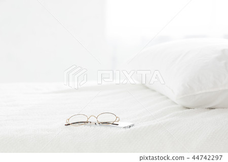 Bed and glasses 44742297