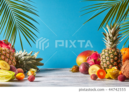 Pineapple, mango, dragon fruit, passion fruit, coconut, carambola, kumquat - frame of exotic fruits 44742555