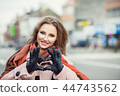 Love. Smiling happy young woman making heart sign 44743562