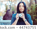 Woman enjoying her tea coffee on the terasse 44743755