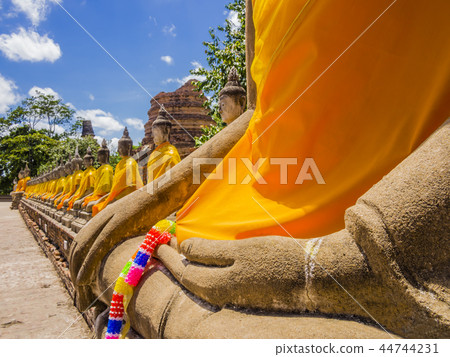 Row of Buddha statues in Ayutthaya, Thailand Row of Buddha statues in Ayutthaya, Thailand 44744231