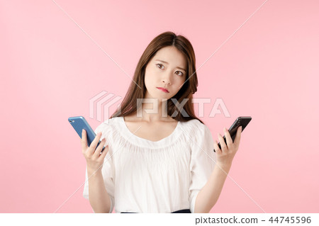 Women comparing smartphones 44745596