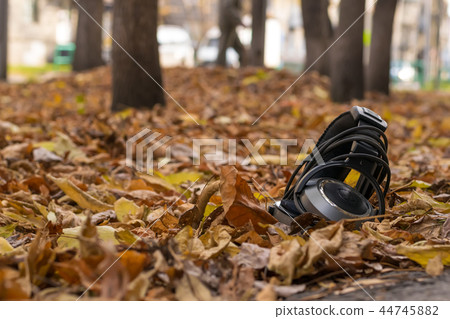 audio old headphones lying in the street 44745882