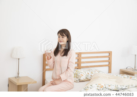 A young woman who takes medicine A young woman who takes medicine 44746083