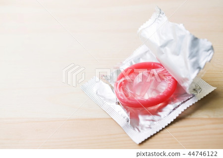 Close up shot of various condom pack on wooden Close up shot of various condom pack on wooden 44746122