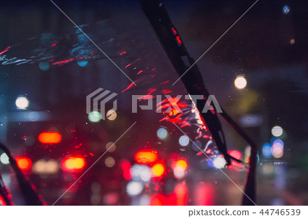 On the rainy day, the rainwater in the car window and the wiper in operation On the rainy day, the rainwater in the car window and the wiper in operation 44746539