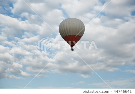 One hot air balloon flying in the sky 44746641