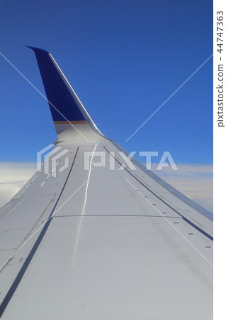 Sky and clouds over the United States taken from a plane (wings and winglets) Sky and clouds over the United States taken from a plane (wings and winglets) 44747363