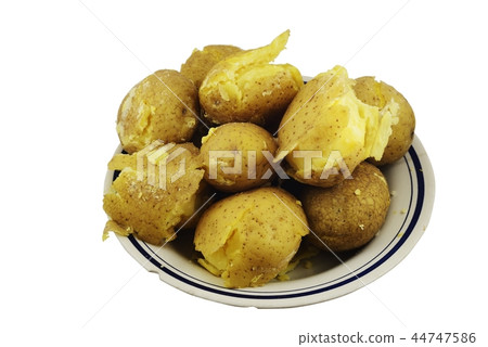 crumbly jacket potatoes in a plate on a white 44747586