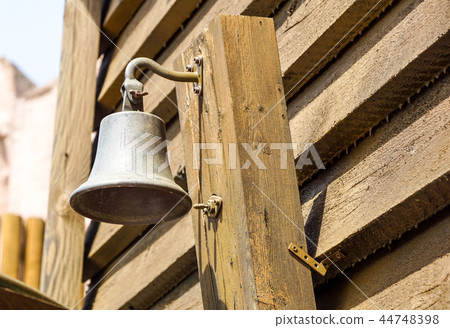 Closeup a golden bell in train station. Traditional sound signaling on the platform at the railway 44748398