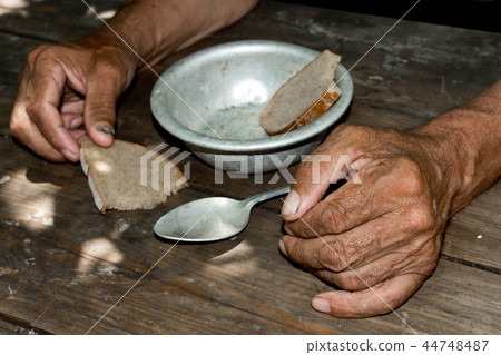 Hands the poor old man's, piece of bread Hands the poor old man's, piece of bread 44748487